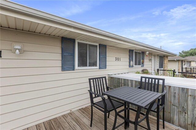 301-A N 3rd St, Odessa, MO 64076 - wooden deck with outdoor dining space