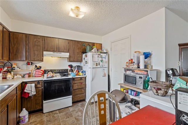 301-A N 3rd St, Odessa, MO 64076 - kitchen with white appliances, under cabinet range hood, light countertops, and a textured ceiling