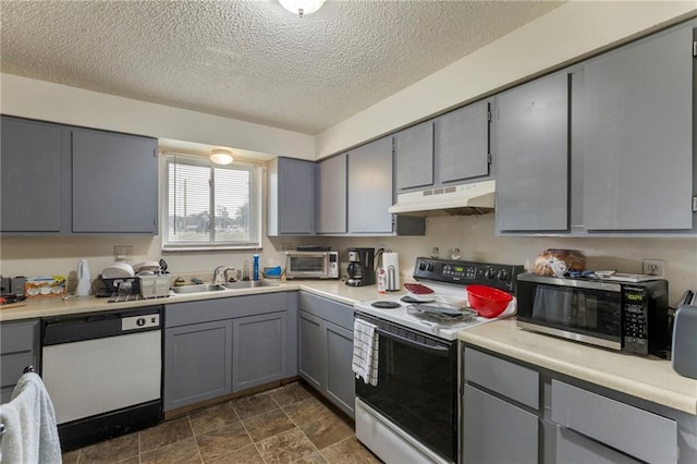 301-A N 3rd St, Odessa, MO 64076 - kitchen with white appliances, gray cabinetry, under cabinet range hood, a textured ceiling, and light countertops