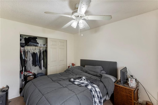 301-A N 3rd St, Odessa, MO 64076 - carpeted bedroom featuring a closet, ceiling fan, and a textured ceiling