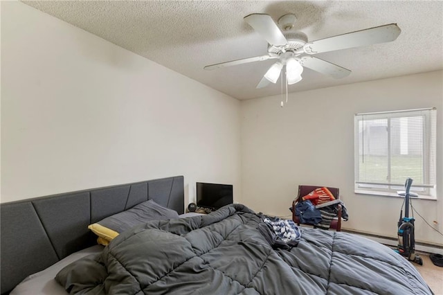 301-A N 3rd St, Odessa, MO 64076 - carpeted bedroom featuring a textured ceiling and a ceiling fan