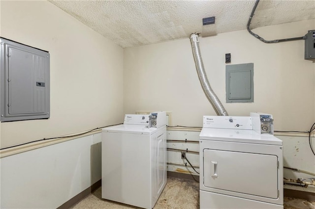 301-A N 3rd St, Odessa, MO 64076 - washroom with independent washer and dryer, electric panel, and a textured ceiling