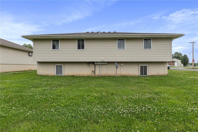301-A N 3rd St, Odessa, MO 64076 - rear view of house with a lawn