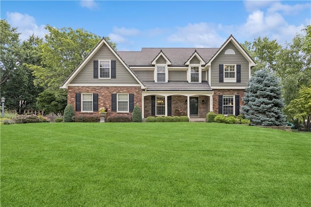 12413 Sagamore Rd, Leawood, KS 66209 - traditional home featuring brick siding, a front yard, and a porch