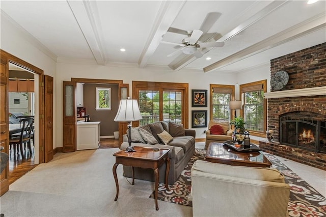 12413 Sagamore Rd, Leawood, KS 66209 - living room featuring beamed ceiling, plenty of natural light, a fireplace, light colored carpet, and recessed lighting