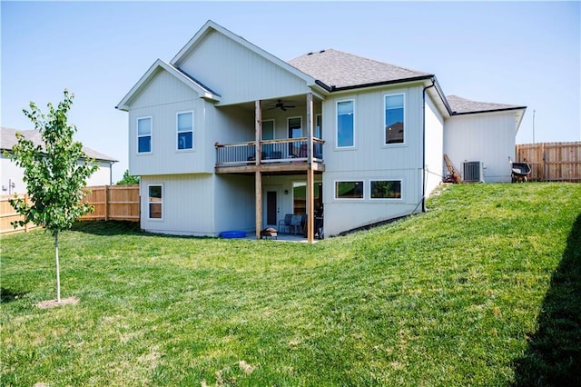2625 SW Summer Creek Pl, Blue Springs, MO 64015 - rear view of property with a ceiling fan, a fenced backyard, roof with shingles, and a balcony