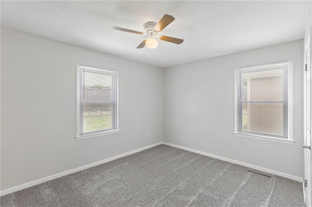 801 NE 67th Ter, Gladstone, MO 64118 - carpeted empty room with a ceiling fan and baseboards