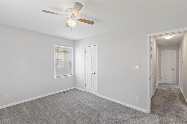 801 NE 67th Ter, Gladstone, MO 64118 - unfurnished bedroom featuring carpet flooring, a closet, and ceiling fan