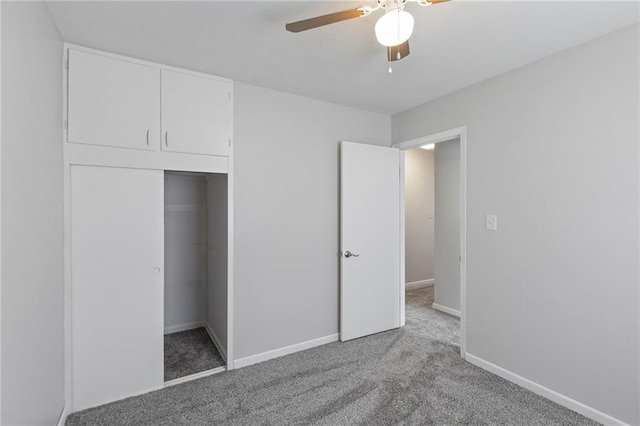 801 NE 67th Ter, Gladstone, MO 64118 - unfurnished bedroom with carpet, a closet, and a ceiling fan