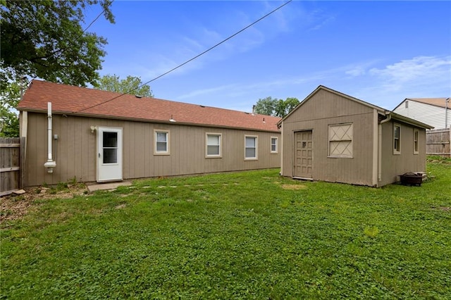 801 NE 67th Ter, Gladstone, MO 64118 - rear view of property featuring a storage shed