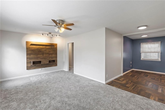 801 NE 67th Ter, Gladstone, MO 64118 - spare room with ceiling fan and baseboards