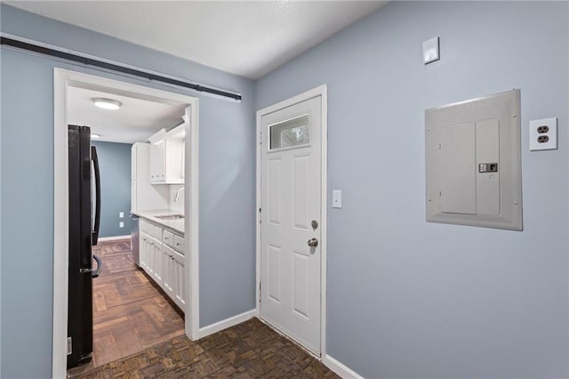 801 NE 67th Ter, Gladstone, MO 64118 - entrance foyer with electric panel and baseboards