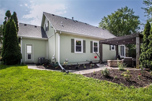 18300 Oak St, Gardner, KS 66030 - rear view of property with a pergola, a shingled roof, a yard, a fire pit, and a patio
