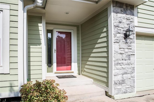 18300 Oak St, Gardner, KS 66030 - doorway to property with a garage and stone siding