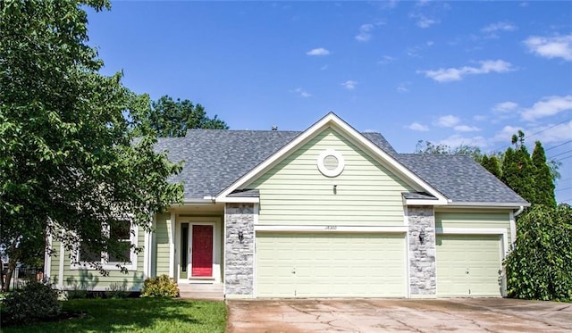 18300 Oak St, Gardner, KS 66030 - ranch-style house with a garage, roof with shingles, driveway, stone siding, and a front yard