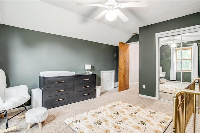 18300 Oak St, Gardner, KS 66030 - carpeted bedroom featuring a closet, vaulted ceiling, and a ceiling fan