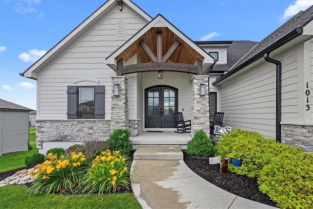 1013 Old Hickory Rd, Greenwood, MO 64034 - property entrance featuring french doors, stone siding, and a porch