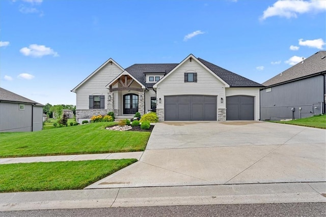 1013 Old Hickory Rd, Greenwood, MO 64034 - view of front of property featuring stone siding, a front lawn, concrete driveway, and a garage