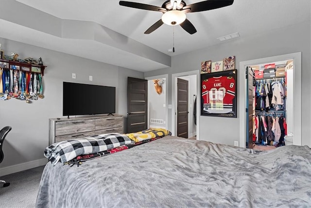 1013 Old Hickory Rd, Greenwood, MO 64034 - bedroom featuring carpet floors, a walk in closet, a closet, and ceiling fan