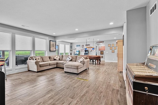 1013 Old Hickory Rd, Greenwood, MO 64034 - living room featuring wood finished floors, a textured ceiling, recessed lighting, and pool table