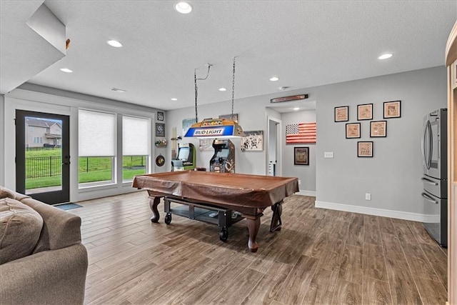 1013 Old Hickory Rd, Greenwood, MO 64034 - game room with billiards table, wood finished floors, a textured ceiling, and recessed lighting