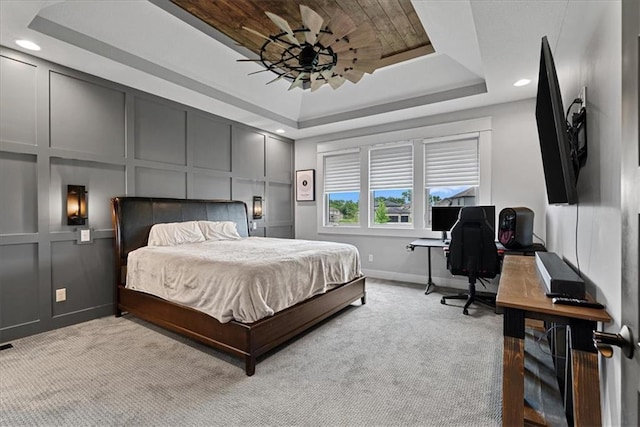 1013 Old Hickory Rd, Greenwood, MO 64034 - bedroom with a raised ceiling, light colored carpet, an office area, recessed lighting, and a decorative wall