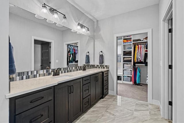 1013 Old Hickory Rd, Greenwood, MO 64034 - bathroom with double vanity, a spacious closet, and marble finish floors