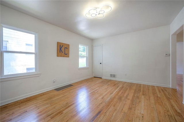 29 S 26th St, Kansas City, KS 66102 - empty room featuring light wood-style floors and baseboards