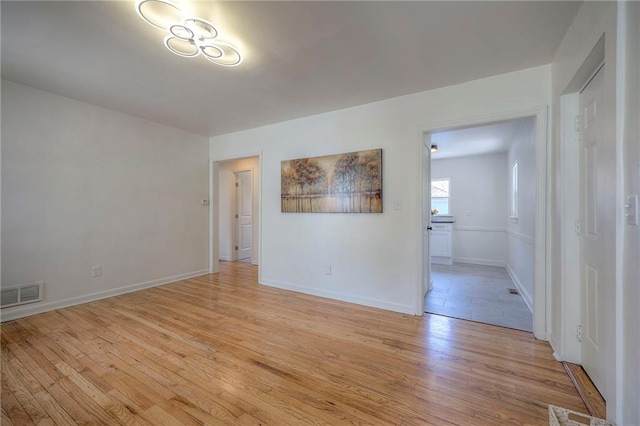 29 S 26th St, Kansas City, KS 66102 - empty room with light wood-style floors and baseboards