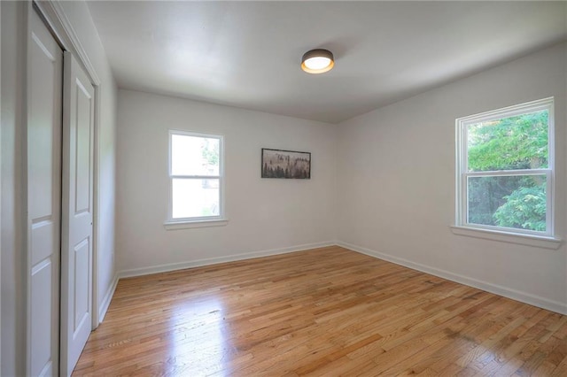 29 S 26th St, Kansas City, KS 66102 - unfurnished bedroom featuring light wood-type flooring and a closet