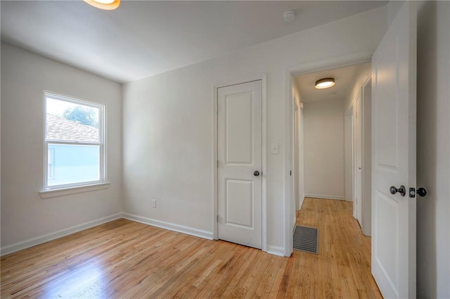 29 S 26th St, Kansas City, KS 66102 - unfurnished bedroom featuring light wood-style floors and baseboards