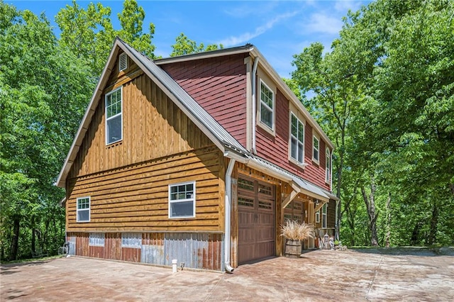 15335 Hh Hwy, Platte City, MO 64079 - view of side of home with an attached garage and concrete driveway