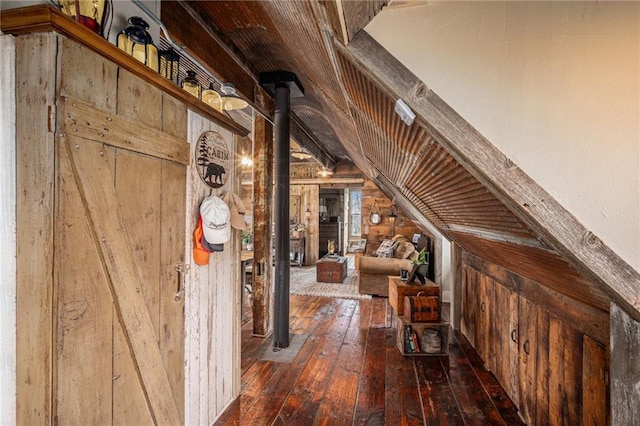 15335 Hh Hwy, Platte City, MO 64079 - hallway featuring wood-type flooring, lofted ceiling, and wooden walls