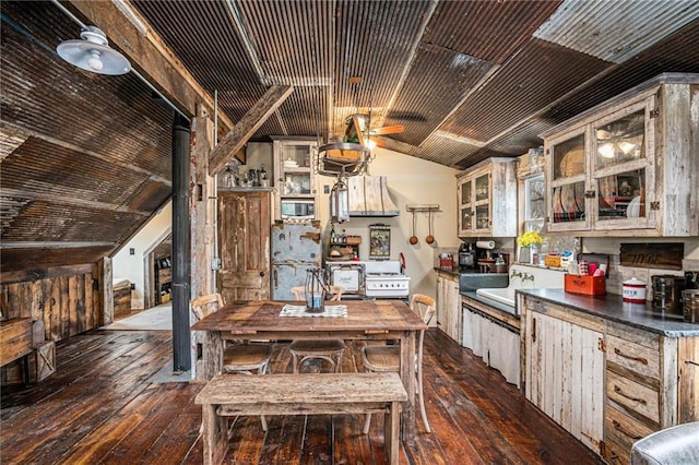 15335 Hh Hwy, Platte City, MO 64079 - kitchen featuring dark wood-style floors, lofted ceiling, glass insert cabinets, ceiling fan, and dark countertops