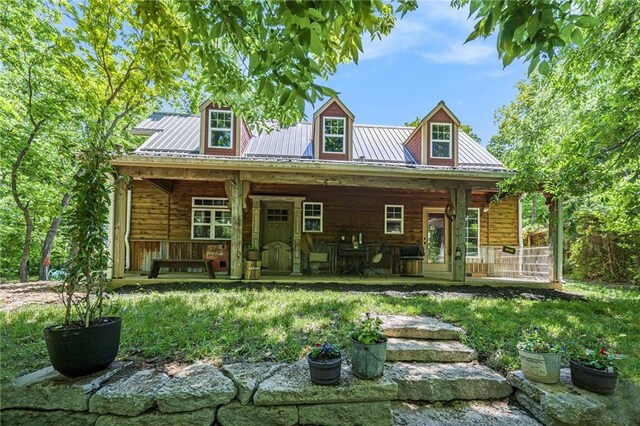 15335 Hh Hwy, Platte City, MO 64079 - view of front of home with covered porch and a metal roof