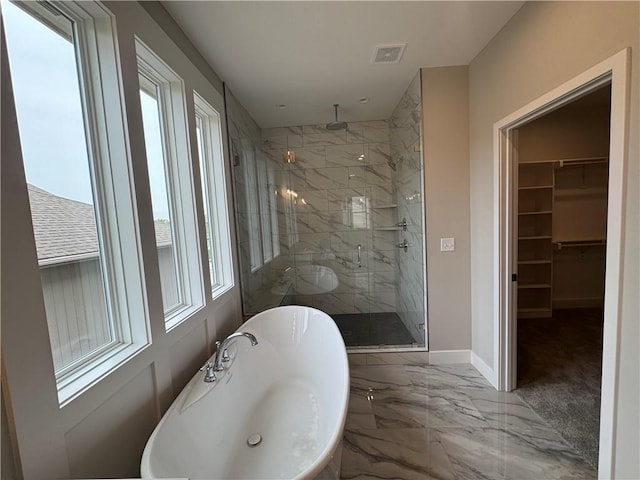11494 S Longview Rd, Olathe, KS 66061 - full bathroom with marble tiled floors, a stall shower, a soaking tub, and a spacious closet