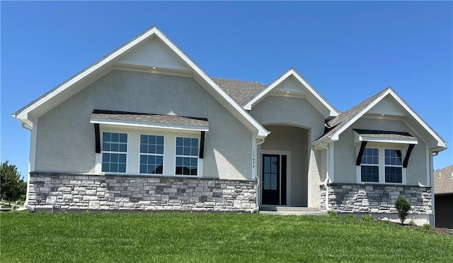 11494 S Longview Rd, Olathe, KS 66061 - view of front of home with stone siding, stucco siding, and a front yard