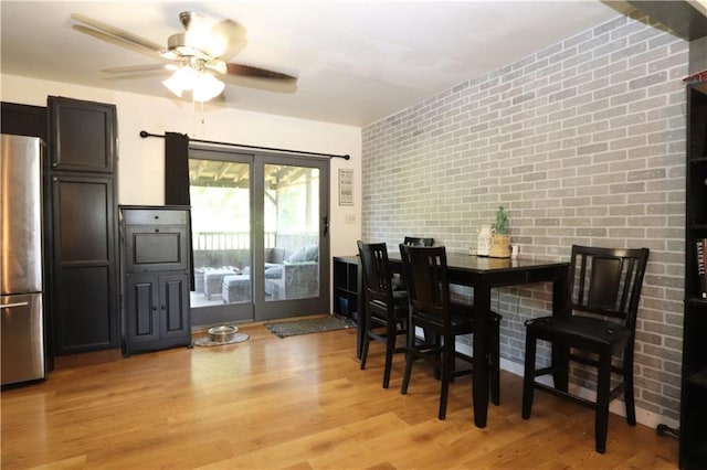 1012 S 10th St, Atchison, KS 66002 - dining space featuring a ceiling fan and light wood-type flooring