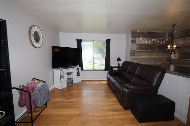 1012 S 10th St, Atchison, KS 66002 - living area featuring wood finished floors and a chandelier