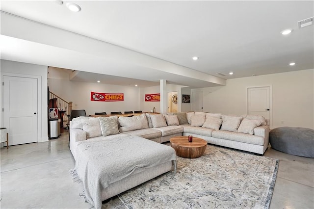 8422 NE 147th St, Liberty, MO 64068 - living room featuring finished concrete flooring, stairway, and recessed lighting