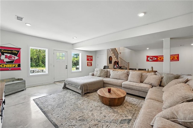 8422 NE 147th St, Liberty, MO 64068 - living area with finished concrete floors, stairs, and recessed lighting