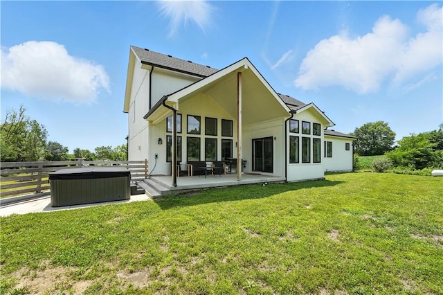 8422 NE 147th St, Liberty, MO 64068 - rear view of house featuring a hot tub and a patio