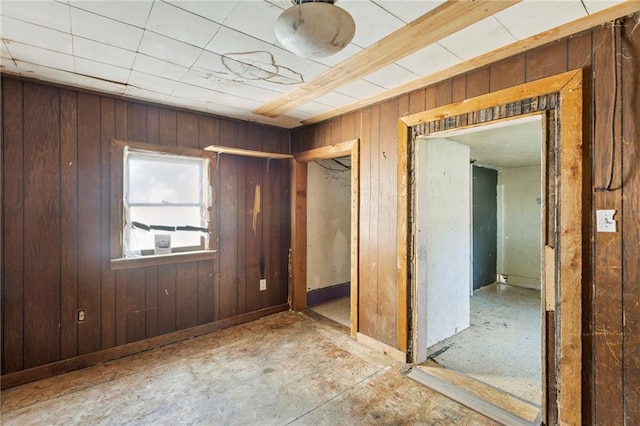 715 Walnut Ave, Osawatomie, KS 66064 - unfurnished bedroom featuring wooden walls