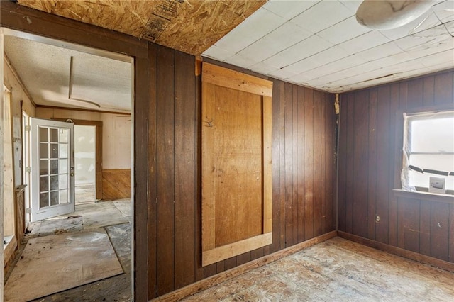 715 Walnut Ave, Osawatomie, KS 66064 - empty room featuring wood walls