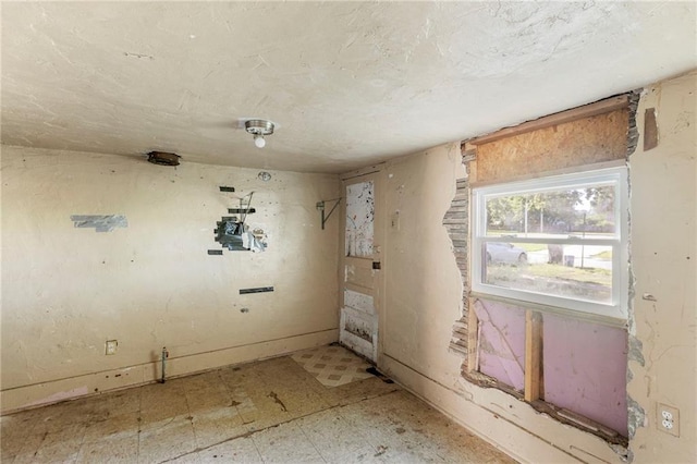 715 Walnut Ave, Osawatomie, KS 66064 - spare room with tile patterned floors