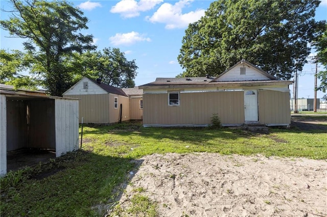 715 Walnut Ave, Osawatomie, KS 66064 - view of green lawn with a storage unit