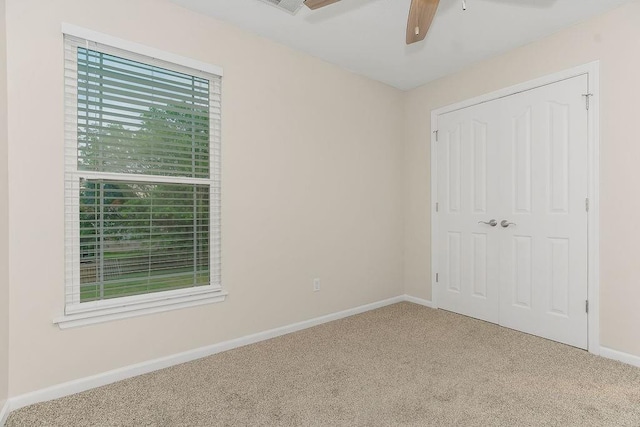1129 SW Georgetown Dr, Lees Summit, MO 64082 - unfurnished bedroom featuring carpet, a closet, and ceiling fan