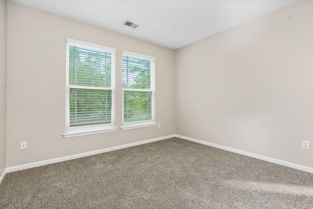 1129 SW Georgetown Dr, Lees Summit, MO 64082 - carpeted empty room featuring baseboards