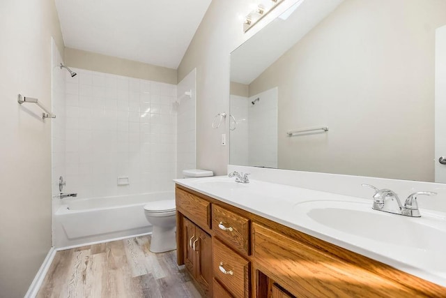 1129 SW Georgetown Dr, Lees Summit, MO 64082 - bathroom with double vanity, wood finished floors, and shower / bath combination