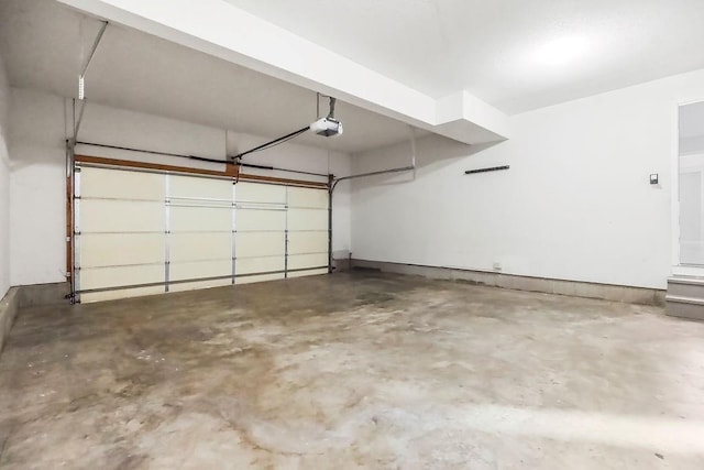 1129 SW Georgetown Dr, Lees Summit, MO 64082 - garage featuring a garage door opener